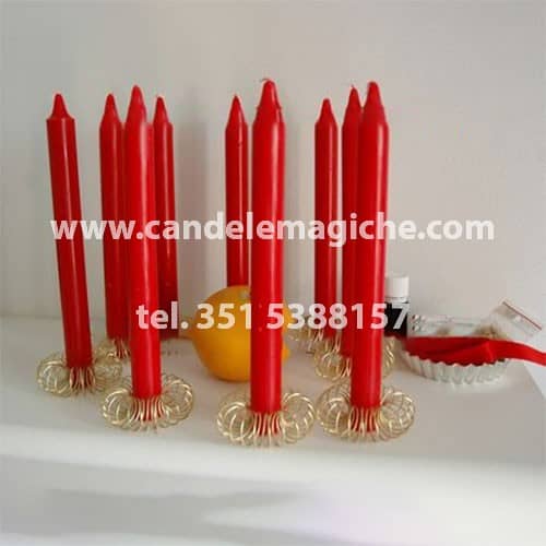 candele rosse e arancia per il legamento d'amore dell'arancia